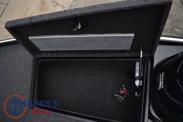 Slide: The Image of Open storage compartment in a 2020 Nitro Z17 boat, featuring organized interior space. - 25