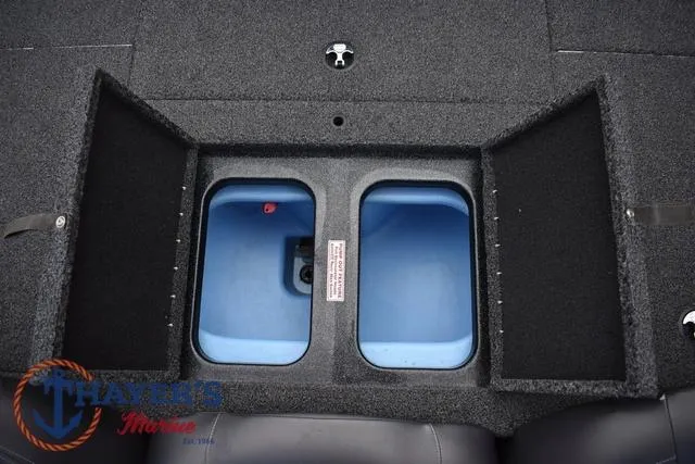 Slide: The Image of 2020 Nitro Z17 boat storage compartments with blue interior and carpeted exterior. - 29