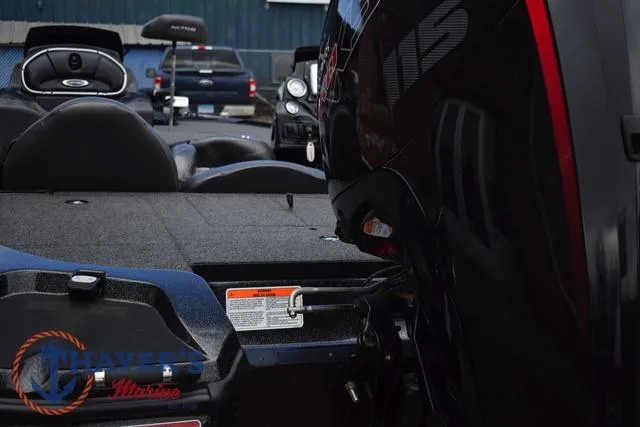 Slide: The Image of 2020 Nitro Z17 boat interior with motor, featuring Thayer's Marine logo. - 37