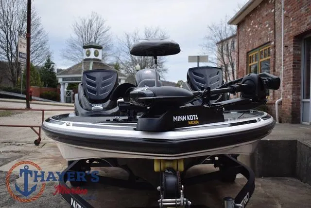 Slide: The Image of 2020 Nitro Z17 boat with Minn Kota Maxxum motor, parked outdoors. - 7