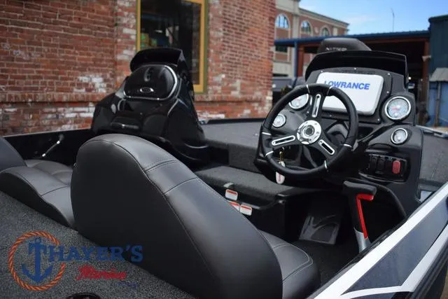 Slide: The Image of 2020 Nitro Z17 boat interior with steering wheel and dashboard, featuring Lowrance electronics. - 8