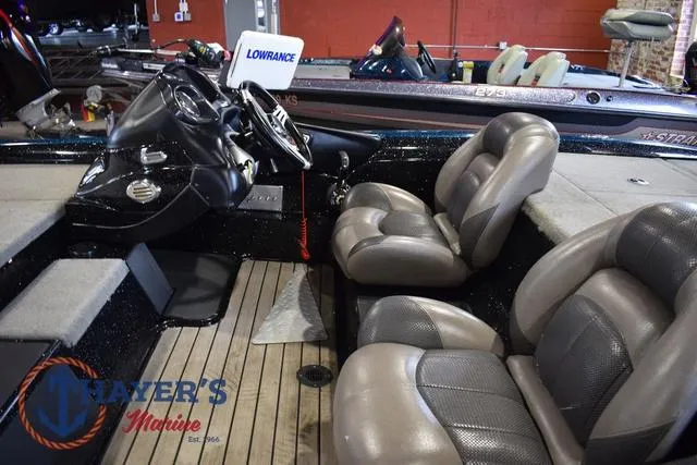 Slide: The Image of 2012 Stratos 294 XLE boat interior with Lowrance system and comfortable seating. - 10