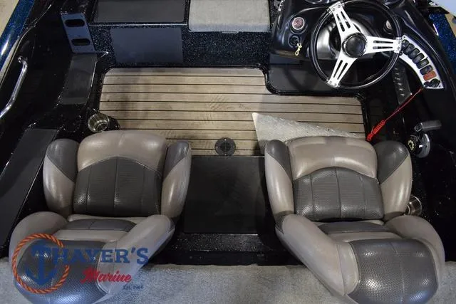 Slide: The Image of Interior of a 2012 Stratos 294 XLE boat with dual seats and steering wheel. - 12