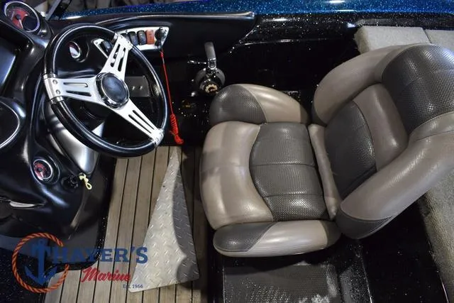 Slide: The Image of Interior of 2012 Stratos 294 XLE boat with steering wheel and seat. - 13