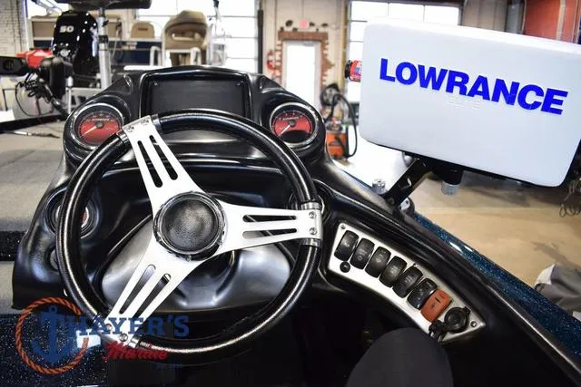 Slide: The Image of Steering console of 2012 Stratos 294 XLE with Lowrance navigation system. - 14