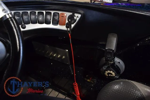 Slide: The Image of Control panel of a 2012 Stratos 294 XLE boat with switches and marine equipment. - 15