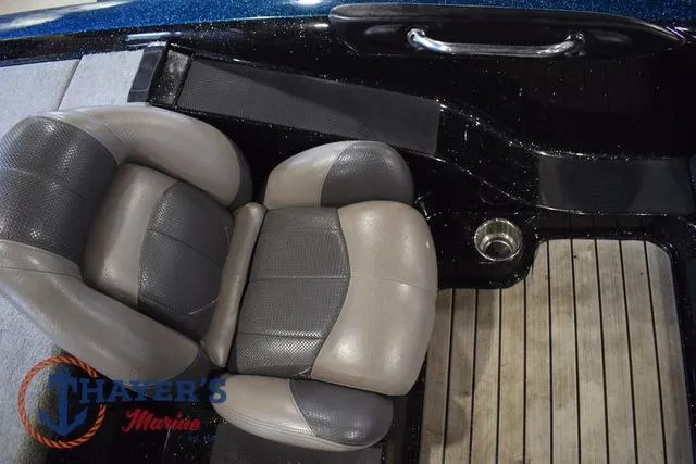 Slide: The Image of Stratos 294 XLE 2012 boat interior with cushioned seats and wooden flooring. - 16
