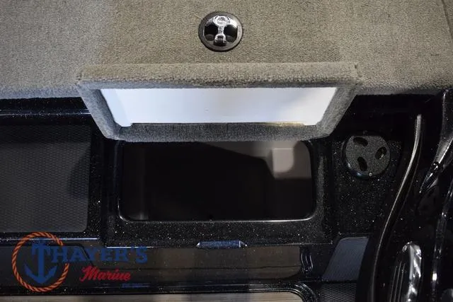 Slide: The Image of Interior compartment of 2012 Stratos 294 XLE boat, featuring storage space and Thayer's Marine logo. - 18