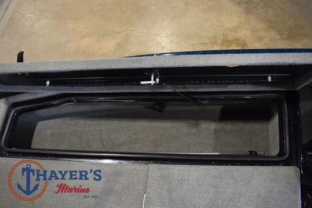 Slide: The Image of Open storage compartment in a 2012 Stratos 294 XLE boat at Thayer's Marine. - 20