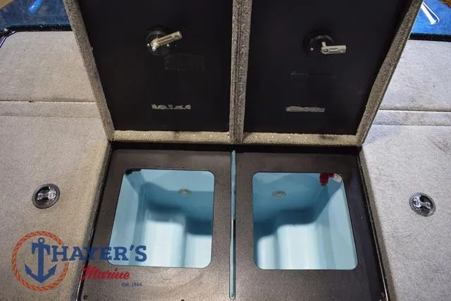 Slide: The Image of 2012 Stratos 294 XLE boat storage compartments with Thayer's Marine logo. - 24