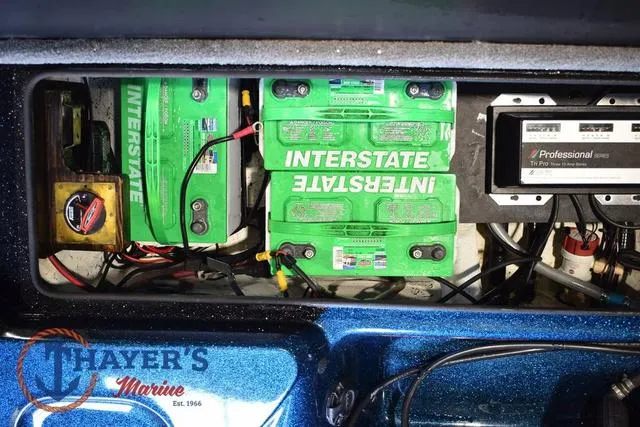 Slide: The Image of 2012 Stratos 294 XLE boat battery compartment with Interstate batteries and wiring. - 28