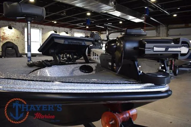 Slide: The Image of 2025 Falcon Bass Boats F20 TE in showroom, featuring advanced navigation equipment. - 12