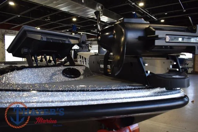 Slide: The Image of 2025 Falcon Bass Boats F20 TE with advanced equipment in showroom setting. - 13
