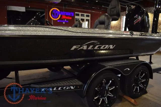 Slide: The Image of 2025 Falcon F20 TE bass boat on display at Thayer's Marine showroom. - 15