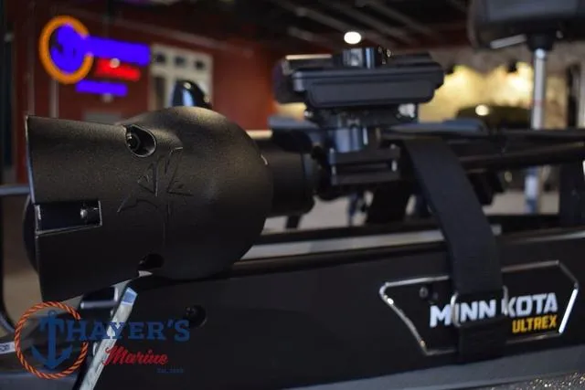 Slide: The Image of 2025 Falcon Bass Boats F20 TE with Minn Kota Ultrex motor, displayed at Thayer's Marine. - 17