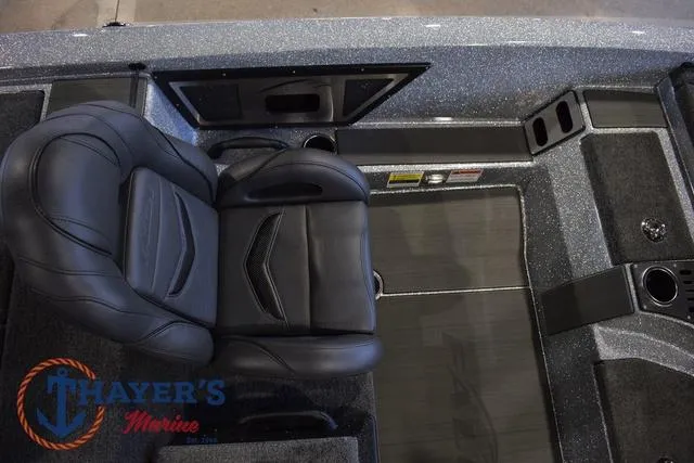Slide: The Image of 2025 Falcon Bass Boats F20 TE interior with black seating and Thayer's Marine logo. - 21