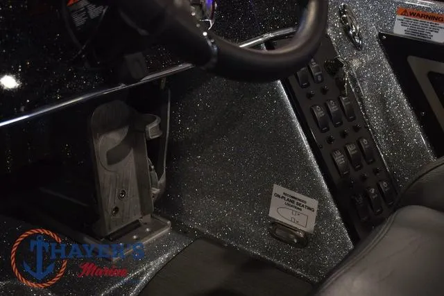 Slide: The Image of 2025 Falcon Bass Boats F20 TE dashboard with control panel and steering wheel. - 24