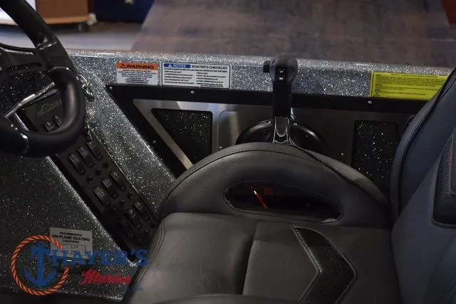 Slide: The Image of 2025 Falcon Bass Boats F20 TE cockpit with steering wheel and control panel. - 25