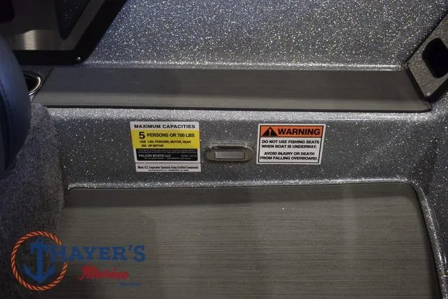 Slide: The Image of 2025 Falcon Bass Boats F20 TE interior with capacity and safety warnings. - 26