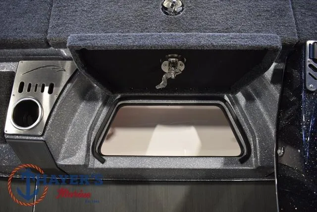 Slide: The Image of 2025 Falcon Bass Boats F20 TE storage compartment with cup holder and secure latch. - 29