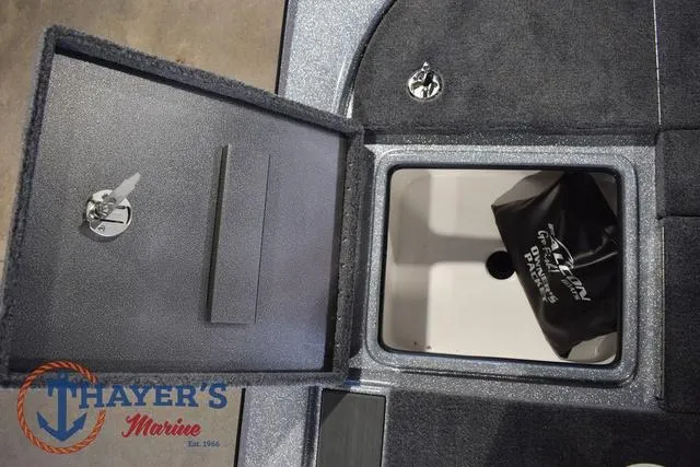 Slide: The Image of 2025 Falcon Bass Boats F20 TE storage compartment with Thayer's Marine logo. - 40
