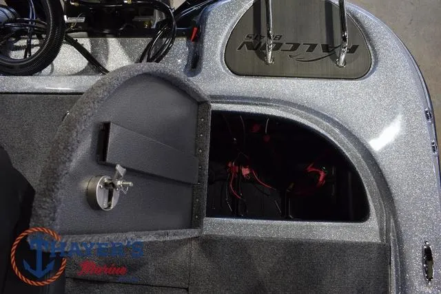 Slide: The Image of 2025 Falcon Bass Boats F20 TE interior storage compartment with wiring, featuring a sleek design. - 42