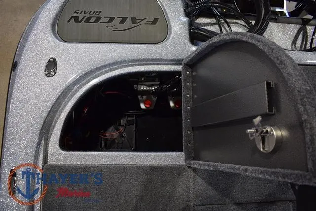 Slide: The Image of 2025 Falcon Bass Boats F20 TE storage compartment with open hatch, showcasing interior details. - 43