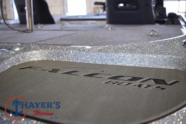 Slide: The Image of 2025 Falcon Bass Boats F20 TE interior with Thayer's Marine logo. - 45