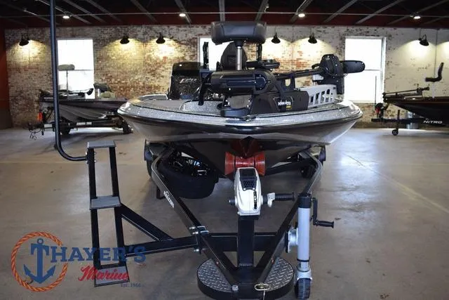 Slide: The Image of 2025 Falcon Bass Boats F20 TE in showroom, front view, on trailer. - 8