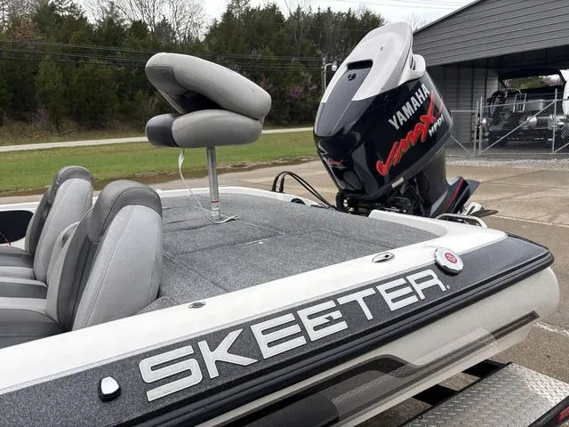 Slide: The Image of 2013 Skeeter TZX190 boat with Yamaha VMAX engine, parked outdoors. - 10