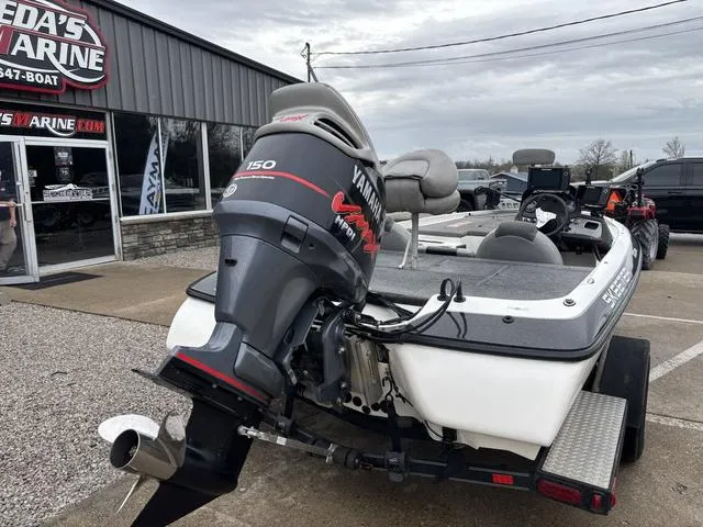 Slide: The Image of 2013 Skeeter TZX190 boat with Yamaha 150 engine at a dealership. - 2