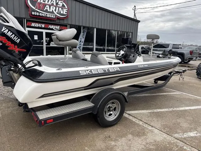 Slide: The Image of 2013 Skeeter TZX190 boat with Yamaha engine on trailer at dealership. - 3
