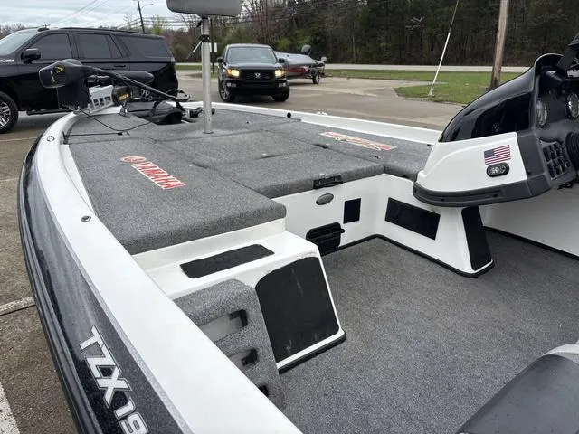 Slide: The Image of 2013 Skeeter TZX190 boat interior with Yamaha branding, parked in a lot. - 9