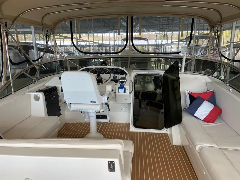Slide: The Image of 2008 Meridian 490 Pilot House interior with helm, seating, and nautical decor. - 42