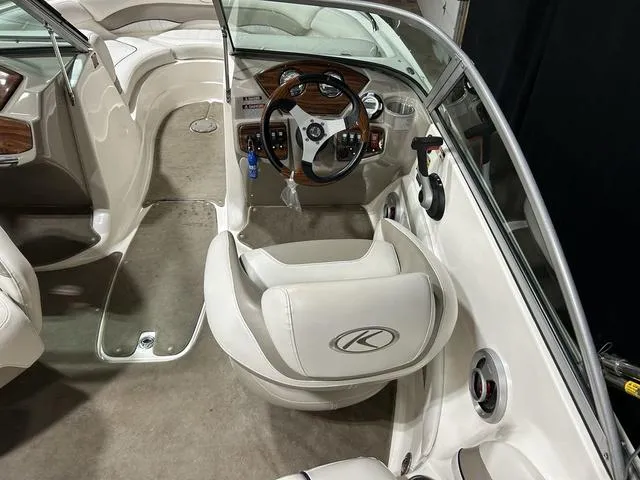 Slide: The Image of 2007 Kayot V220i boat interior with steering wheel and seating. - 12