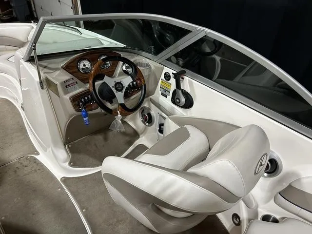Slide: The Image of 2007 Kayot V220i boat interior with steering wheel and dashboard controls. - 14