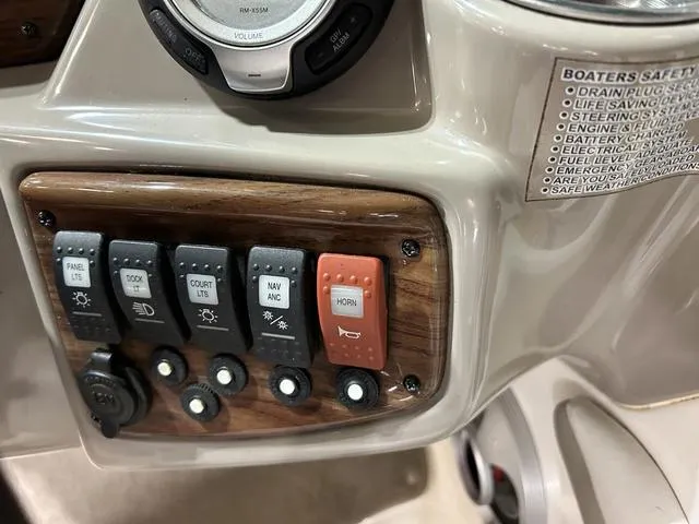 Slide: The Image of Control panel of a 2007 Kayot V220i boat with labeled switches and safety instructions. - 17