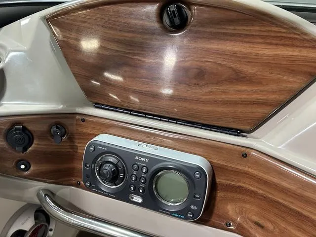 Slide: The Image of 2007 Kayot V220i dashboard with Sony stereo and wood paneling. - 20