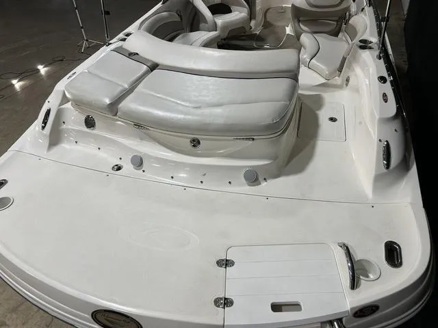 Slide: The Image of 2007 Kayot V220i boat with white seating and sleek design. - 24