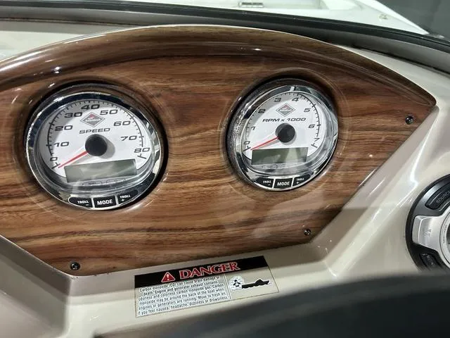 Slide: The Image of Dashboard of 2007 Kayot V220i boat with speedometer and tachometer gauges. - 26