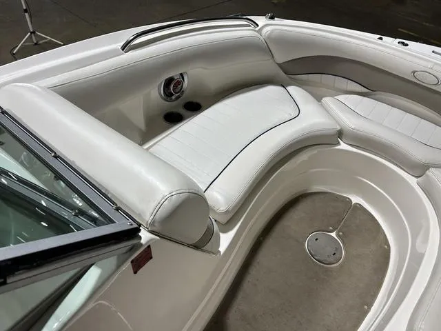 Slide: The Image of 2007 Kayot V220i boat interior with white leather seating and cup holders. - 28