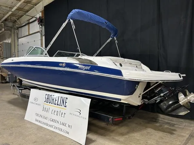 Slide: The Image of 2007 Kayot V220i boat with blue canopy displayed at Shoreline Boat Center. - 3