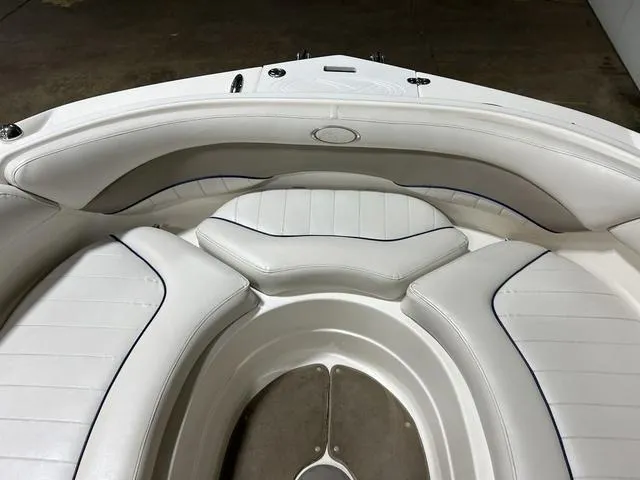 Slide: The Image of 2007 Kayot V220i boat interior with white cushioned seating. - 31