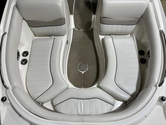 Slide: The Image of 2007 Kayot V220i boat interior with white cushioned seating and sleek design. - 32