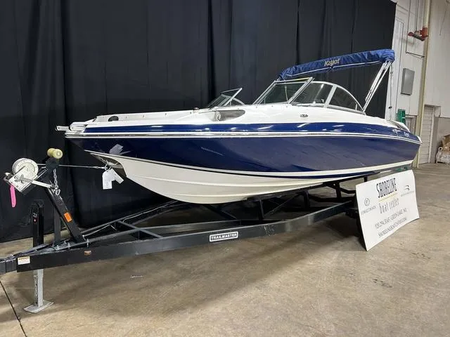 Slide: The Image of 2007 Kayot V220i boat on trailer in indoor setting. - 6
