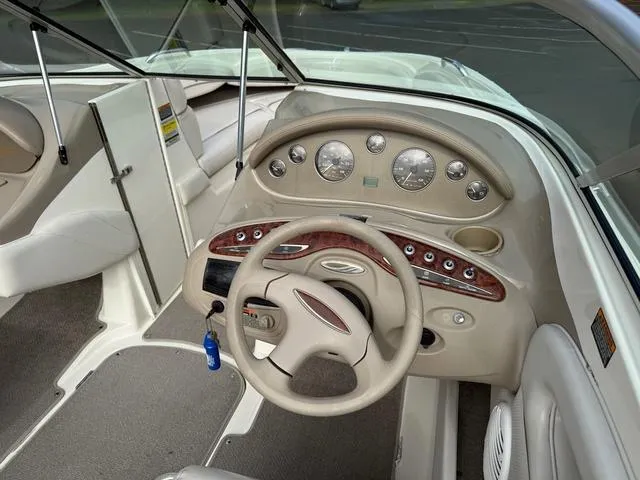 Slide: The Image of Interior view of 2000 Maxum 2100SR boat dashboard with steering wheel and gauges. - 5