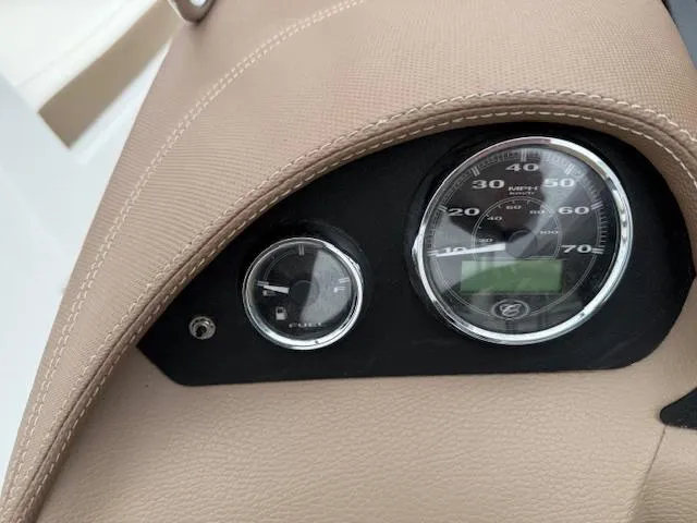 Slide: The Image of Dashboard of a 2012 Cobalt 220S boat with speedometer and fuel gauge. - 11