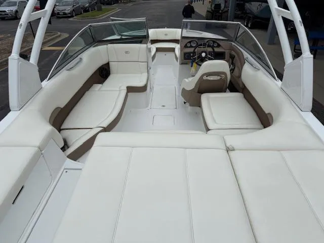 Slide: The Image of 2012 Cobalt 220S boat interior with white seating and steering console. - 4