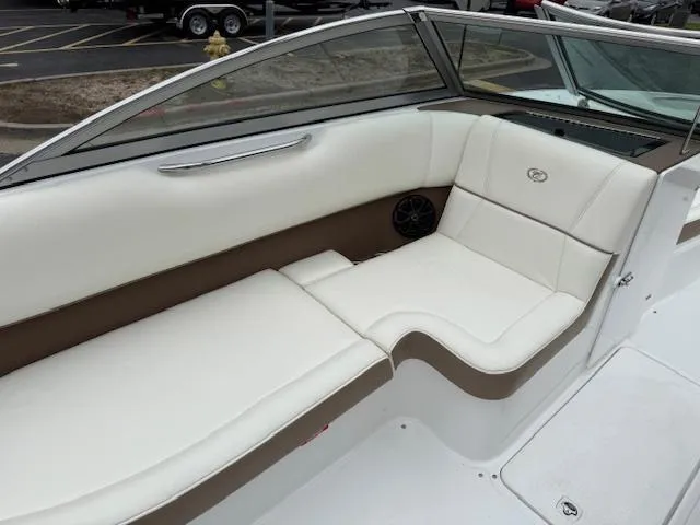 Slide: The Image of Interior of a 2012 Cobalt 220S boat with white and beige seating. - 7