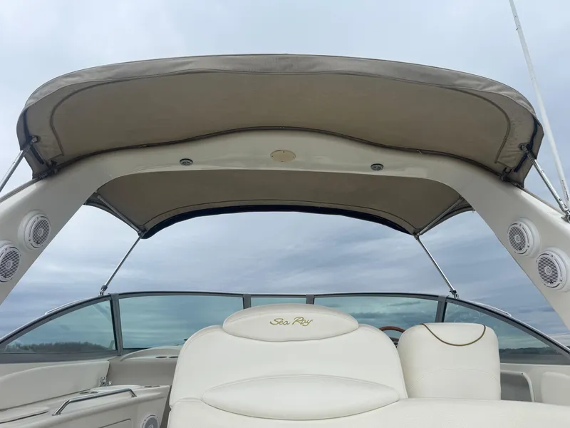 Slide: The Image of 2000 Sea Ray 340 Sundancer boat interior with canopy and seating. - 15
